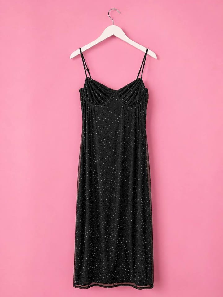Black polka-dot mesh slip dress, midi length, on a hanger