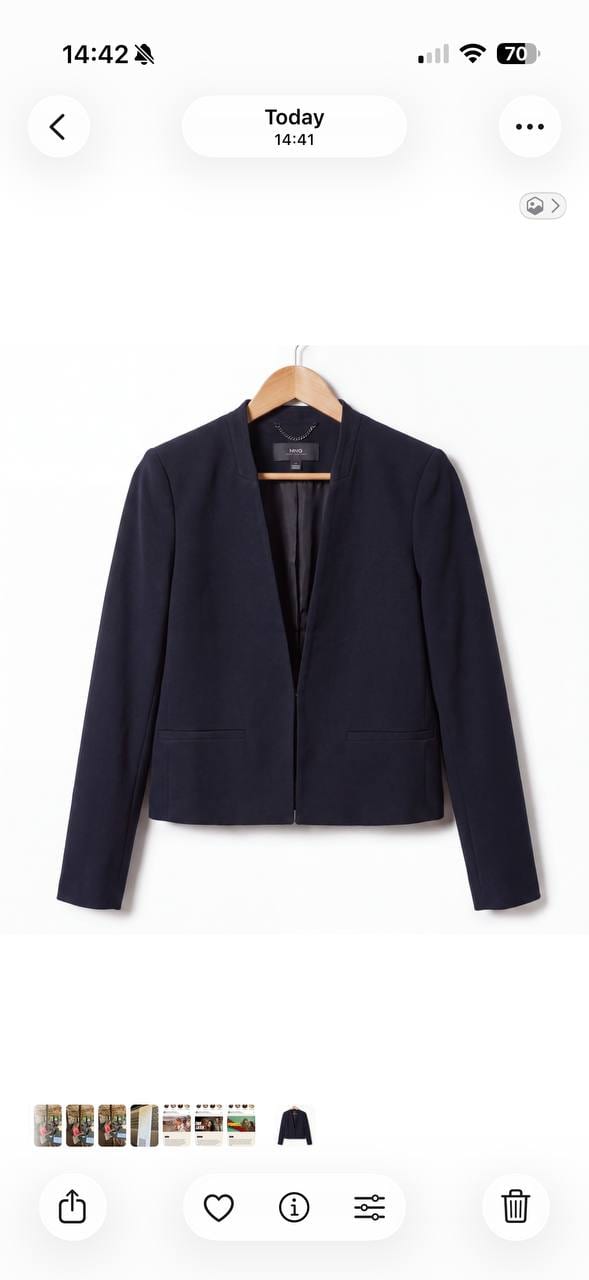 Navy collarless fitted blazer on a hanger